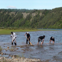 four men in river